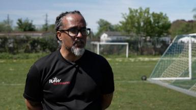 Roddy Slater standing on a football pitch