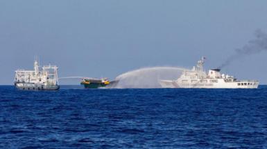 Chinese Coast Guard vessels fire water cannons towards a Philippine resupply vessel Unaizah May 4 on its way to a resupply mission at Second Thomas Shoal in the South China Sea, March 5, 2024. 