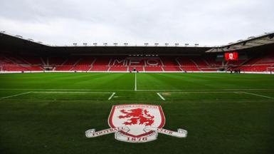 A view of the Riverside Stadium with Middlesbrough's badge on the artificial matting in front of the pitch