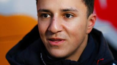 Close-up of Isack Hadjar's face and dark collar