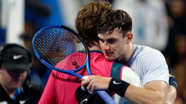 Jack Draper hugging Andrey Rublev over the net at the end of the match