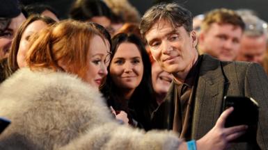 Cillian Murphy with a fan taking a selfie at the film's premiere in Birmingham