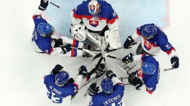 Slovakia's para-ice hockey team in a circle