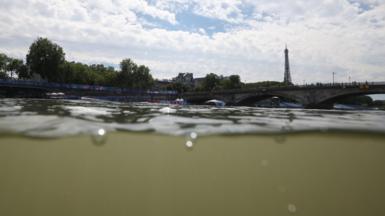 The River Seine, as seen from the start of the triathlon course, with the camera partly underwater - the Eiffel Tower can be seen in the background