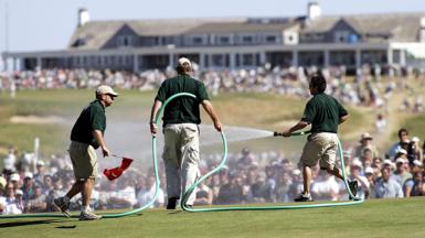 Greenstaff watering the par-three seventh green during the final round of the 2004 US Open at Shinnecock Hills, New York.