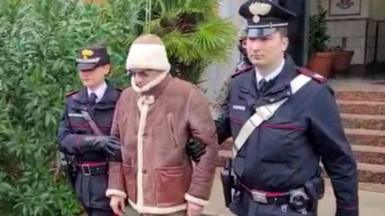 A screengrab taken from a video shows Matteo Messina Denaro the country's most wanted mafia boss being escorted out of a Carabinieri police station after he was arrested in Palermo, Italy, January 16, 2023.