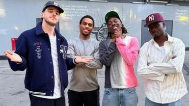 Eberechi Eze with fellow Arsenal players outside the Emirates