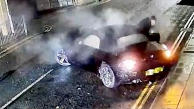 A BMW crashed into the side of a house