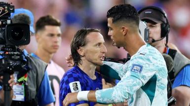 Luka Modric and Cristiano Ronaldo embrace at the end of the game