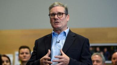 British Prime Minister Sir Keir Starmer speaking in front of a small crowd