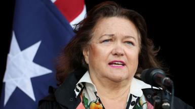 Gina Rinehart speaking at an Australia Day event in 2025, pictured with the Australian flag behind her