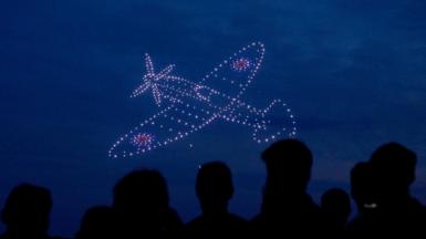 Drone lights creating image of spitfire plane