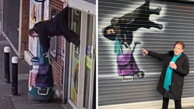 On the left is a CCTV grab of a woman hanging mid air, her coat caught ina shop front shutter/ On the right, the same woman, with short red hair and a black coat, is stood in front of the shutter, pointing at a painting on the shutter depicting her hanging, holding onto a purple shopping trolley.