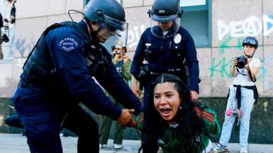 Woman being arrested