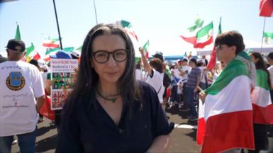 Shaimaa Khalil surrounded by protesters waving flags