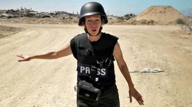 Lucy Williamson in Gaza wearing a helmet and protective equipment