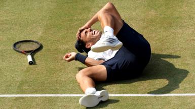 Francisco Cerundolo falls to the floor in celebration