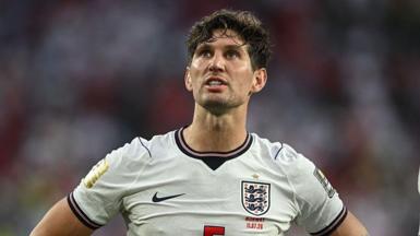 John Stones wearing an England shirt