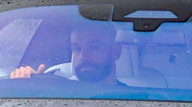 Mohamed Salah driving away from Liverpool's training ground