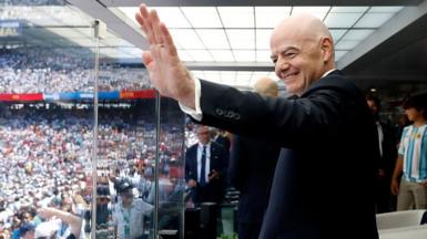 FIFA president Gianni Infantino waves before the World Cup final between Spain and Argentina