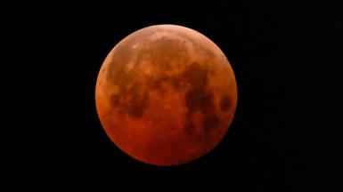  The full moon, also known as the "Blood Moon," is seen in Mexico City on March 14, 2025, during a lunar eclipse.