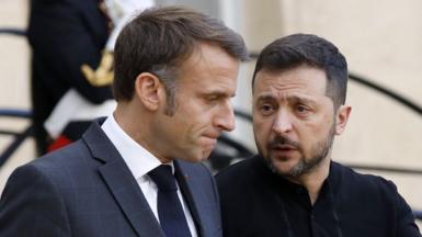 Close up of Emmanuel Macron and Volodymyr Zelensky speaking outside the Elysee Palace in PAris