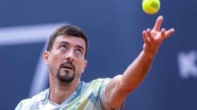 Sebastian Ofner throws the ball to serve