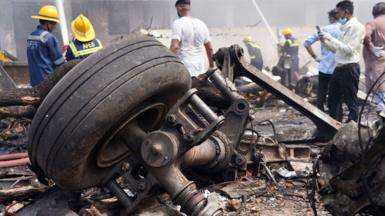 Debris at the site of a plane crash near Sardar Vallabhbhai Patel International Airport in Ahmedabad, Gujarat, western India, 12 June 2025. 