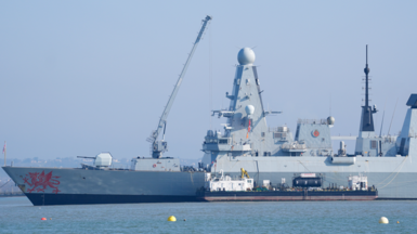Royal Navy Type 45 destroyer HMS Dragon at the Upper Harbour Ammunition Facility (UHAF) in Portsmouth harbour