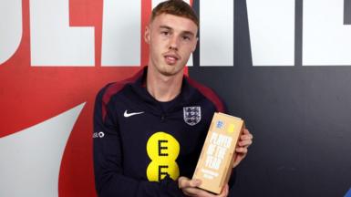 Cole Palmer poses with his England player of the year trophy