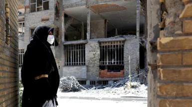 A woman looks at the rubble of her house, which was damaged in a U.S. and Israeli strike in March, in Tehran, Iran June 7, 2026
