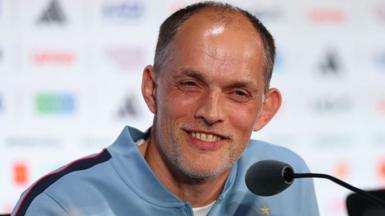 England head coach Thomas Tuchel sits by a microphone at a news conference