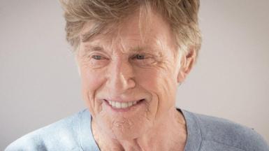 Robert Redford is seen in later life.  He is smiling and looking slightly off camera.