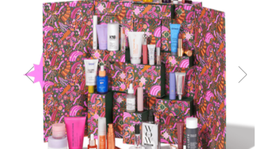 Space NK advent calendar showing a pink print box and various miniature beauty products