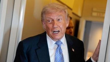 U.S. President Donald Trump speaks to the press aboard Air Force One enroute to the U.S. following his official visit with President Xi Jinping in China, May 15, 2026. 