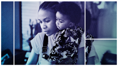 Woman with baby son working on a laptop at home