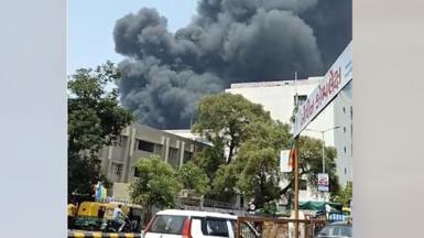 Plumes of black smoke in the sky