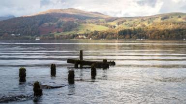 A partially sunk jetty on the banks of Lake Windermere