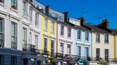 A street scene showing multi-coloured townhouses that featured in the Paddington film.