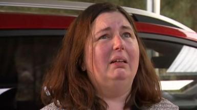 A close up of Erin Patterson crying