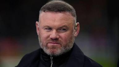 Wayne Rooney looks on