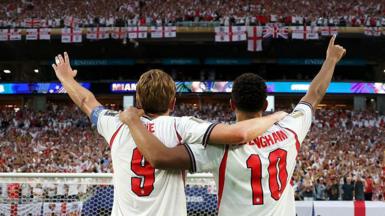 Jude Bellingham and Harry Kane of England salute the fans after the 2-1 victory over Norway