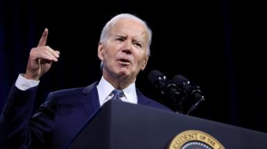 Biden on stage with his finger in the air at the 115th NAACP National Convention in Las Vegas, Nevada, US, July 16, 2024.