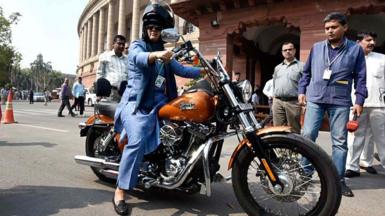 Ranjeet Ranjan, Congress party MP from Supaul, Bihar and wife of Pappu Yadav arrives at Parliament House on her Harley Davidson bike