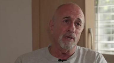 Richard Manville wearing a grey t-shirt
