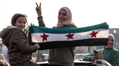 Syrians gather at Umayyad Square to celebrate the collapse of 61 years of Baath Party rule with songs and convoys of cars in Damascus, Syria on 9 December 2024