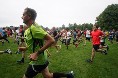 Runners take part in the Parkrun at Bushy Park in London