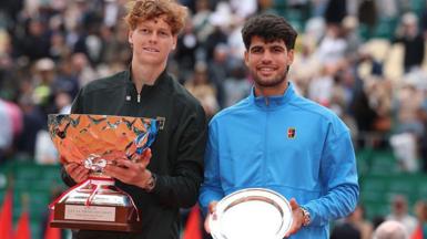 Jannik Sinner holds the Monte Carlo Master trophy alongside Carlos Alcaraz