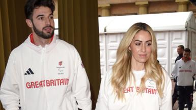 Zac Shaw and Paralympic sprinter Ali Smith in white GB tracksuits at the Olympic reception at Buckingham Palace on Thursday