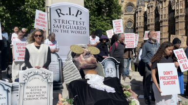Campaigners opposing the assisted dying legislation demonstrate outside the Palace of Westminster.